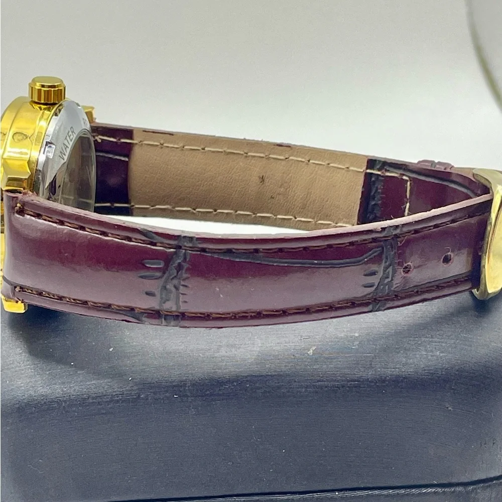 Gold Tone Skeleton Mechanical Watch with Burgundy Faux Textured Leather Strap